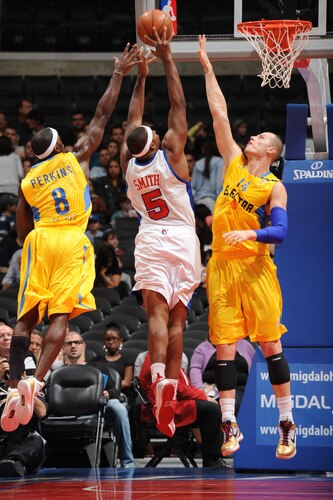 LOS ANGELES - OCTOBER 20:  Craig Smith #5 of the Los Angeles Clippers attempts a shot between Doron Perkins #8 and Maciej Lampe #14 of Maccabi Electra Tel Aviv at Staples Center on October 20, 2009 in Los Angeles, California. <br /><br /><span class="help">(Photo by Noah Graham/NBAE via Getty Images)</span>