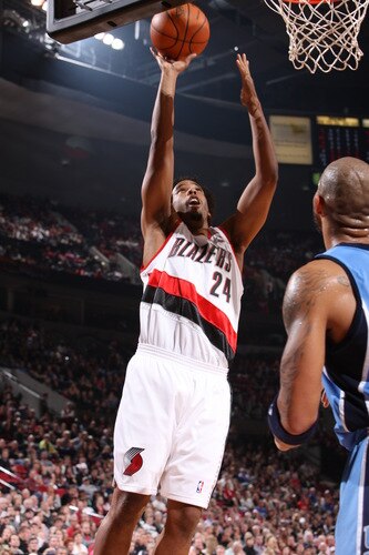 PORTLAND, OR - OCTOBER 20:  Andre Miller #24 of the Portland Trail Blazers takes a shot over Carlos Boozer #5 of the Utah Jazz during a game on October 20, 2009 at the Rose Garden Arena in Portland, Oregon. <br /><br /><span class="help">(Photo by Sam Forencich/NBAE via Getty Images)</span>