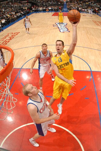 LOS ANGELES - OCTOBER 20:  Chuck Eidson #13 of Maccabi Electra Tel Aviv puts up a shot against Chris Kaman #35 of the Los Angeles Clippers at Staples Center on October 20, 2009 in Los Angeles, California. <br /><br /><span class="help">(Photo by Andrew D. Bernstein/NBAE via Getty Images)</span>