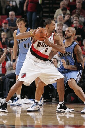 PORTLAND, OR - OCTOBER 20: Juwan Howard #6 of the Portland Trail Blazers looks for an opening around Carlos Boozer #5 of the Utah Jazz during a preseason game on October 20, 2009 at the Rose Garden Arena in Portland, Oregon. <br /><br /><span class="help">(Photo by Sam Forencich/NBAE via Getty Images)</span>