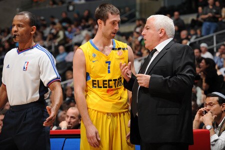 LOS ANGELES - OCTOBER 20:  Andrew Wisniewski #7 of Maccabi Electra Tel Aviv speaks to Head Coach Pinhas Gershon during their game against the Los Angeles Clippers at Staples Center on October 20, 2009 in Los Angeles, California. <br /><br /><span class="help">(Photo by Noah Graham/NBAE via Getty Images)</span>