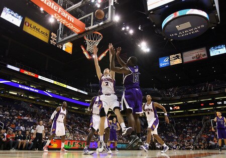 PHOENIX - OCTOBER 20:  Tyreke Evans #13 of the Sacramento Kings lays up a shot over Goran Dragic #2 of the Phoenix Suns during the NBA preseason game at US Airways Center on October 20, 2009 in Phoenix, Arizona. The Suns defeated the Kings 143-127. <br /><br /><span class="help">(Photo by Christian Petersen/Getty Images)</span>