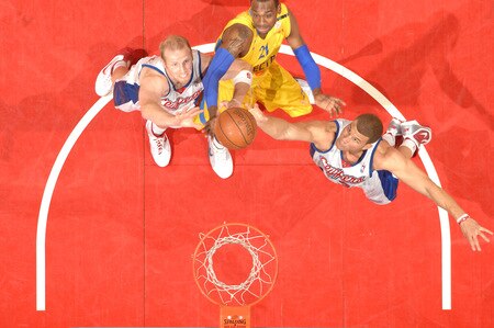 LOS ANGELES - OCTOBER 20:  Chris Kaman #35 and Blake Griffin #32 of the Los Angeles Clippers reach for a rebound against D'or Fischer #21 of Maccabi Electra Tel Aviv at Staples Center on October 20, 2009 in Los Angeles, California. <br /><br /><span class="help">(Photo by Andrew D. Bernstein/NBAE via Getty Images)</span>