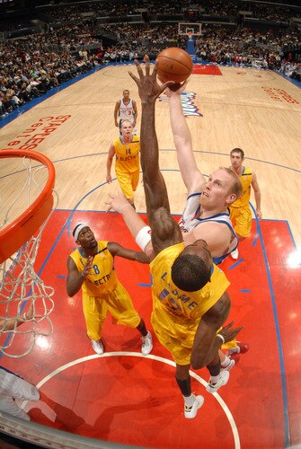 LOS ANGELES - OCTOBER 20:  Chris Kaman #35 of the Los Angeles Clippers puts up a shot against Stephane Lasme #12 of Maccabi Electra Tel Aviv at Staples Center on October 20, 2009 in Los Angeles, California. <br /><br /><span class="help">(Photo by Andrew D. Bernstein/NBAE via Getty Images)</span>