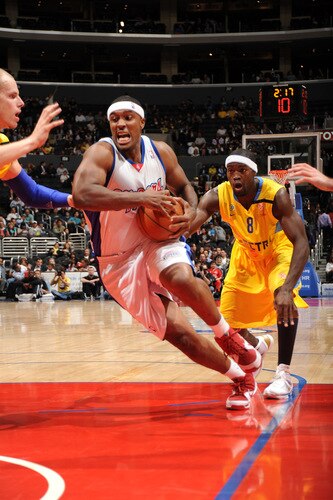 LOS ANGELES - OCTOBER 20:  Craig Smith #5 of the Los Angeles Clippers drives to the basket past Doron Perkins #8 of Maccabi Electra Tel Aviv at Staples Center on October 20, 2009 in Los Angeles, California. <br /><br /><span class="help">(Photo by Andrew D. Bernstein/NBAE via Getty Images)</span>