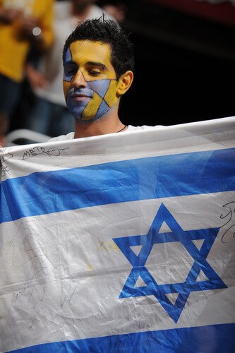 LOS ANGELES - OCTOBER 20:  A fan holds up an Israeli flag during a game between Maccabi Electra Tel Aviv and the Los Angeles Clippers at Staples Center on October 20, 2009 in Los Angeles, California. <br /><br /><span class="help">(Photo by Noah Graham/NBAE via Getty Images)</span>