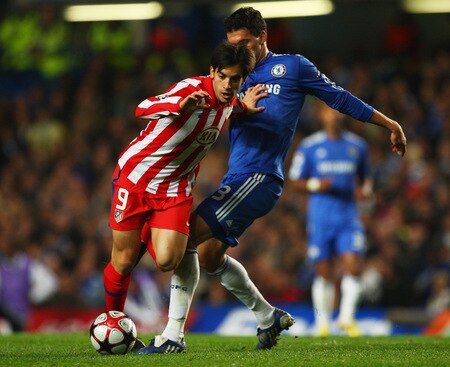 LONDON - OCTOBER 21:  Jose Manuel Jurado of Atletico Madrid holds off Michael Ballack of Chelsea looks on during the UEFA Champions League Group D match between Chelsea and Atletico Madrid at Stamford Bridge on October 21, 2009 in London, England.  <br /><br /><span class="help">(Photo by Richard Heathcote/Getty Images)</span>