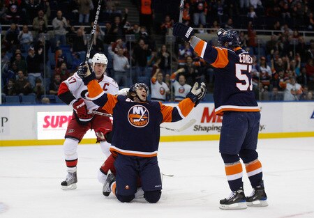 UNIONDALE, NY- OCTOBER 21: Matt Moulson #26 of the New York Islanders celebrates with teammate Blake Comeau #57 after scoring a goal against the Carolina Hurricanes during the game on October 21, 2009 at  in Uniondale, NY.  <br /><br /><span class="help">(Photo by Jared Wickerham/Getty Images)</span>