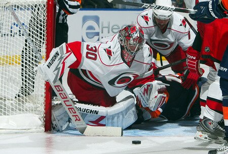 UNIONDALE, NY - OCTOBER 21:  Cam Ward #30 of the Carolina Hurricanes makes a save against the New York Islanders on October 21, 2009 at Nassau Coliseum in Uniondale, New York.  <br /><br /><span class="help">(Photo by Jim McIsaac/Getty Images)</span>