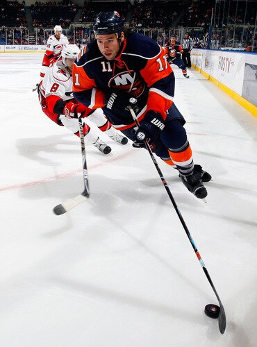 UNIONDALE, NY - OCTOBER 21:  Nate Thompson #11 of the New York Islanders skates against the Carolina Hurricanes on October 21, 2009 at Nassau Coliseum in Uniondale, New York.  <br /><br /><span class="help">(Photo by Jim McIsaac/Getty Images)</span>