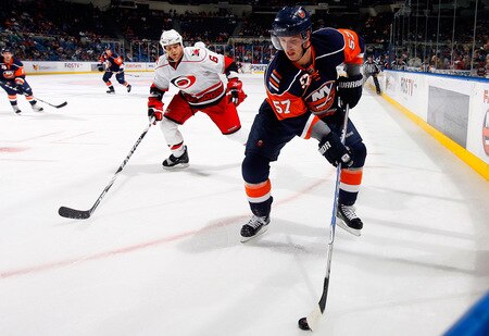 UNIONDALE, NY - OCTOBER 21:  Blake Comeau #57 of the New York Islanders skates against Tim Gleason #6 of the Carolina Hurricanes on October 21, 2009 at Nassau Coliseum in Uniondale, New York.  <br /><br /><span class="help">(Photo by Jim McIsaac/Getty Images)</span>