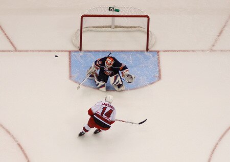UNIONDALE, NY- OCTOBER 21: Dwayne Roloson #30 of the New York Islanders makes a save against Sergei Samsonov #14 of the Carolina Hurricanes during the game on October 21, 2009 at  in Uniondale, NY.  <br /><br /><span class="help">(Photo by Jared Wickerham/Getty Images)</span>