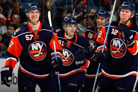UNIONDALE, NY - OCTOBER 21:  John Tavares #91 of the New York Islanders celebrates with his teammates after scoring the winning shoot out goal against the Carolina Hurricanes on October 21, 2009 at Nassau Coliseum in Uniondale, New York. The Isles won the game 4-3 after a shoot out.  <br /><br /><span class="help">(Photo by Jim McIsaac/Getty Images)</span>