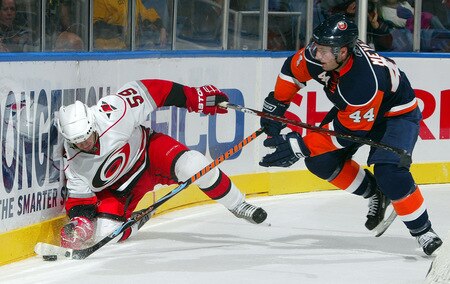 UNIONDALE, NY - OCTOBER 21:  Chad LaRose #59 of the Carolina Hurricanes loses the puck against Freddy Meyer #44 of the New York Islanders on October 21, 2009 at Nassau Coliseum in Uniondale, New York. The Isles won the game 4-3 after a shoot out.  <br /><br /><span class="help">(Photo by Jim McIsaac/Getty Images)</span>
