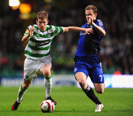 GLASGOW, SCOTLAND - OCTOBER 22:  Mark Wilson of Celtic is tackled by Marcell Jansen of Hamburg SV during the UEFA Europa League Group C match between Celtic and Hamburg SV at Celtic Park on October 22, 2009 in Glasgow, Scotland.  <br /><br /><span class="help">(Photo by Mike Hewitt/Bongarts/Getty Images)</span>