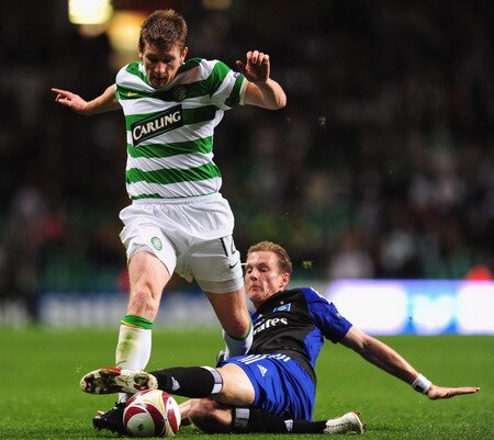 GLASGOW, SCOTLAND - OCTOBER 22:  Mark Wilson of Celtic is tackled by Marcell Jansen of Hamburg SV during the UEFA Europa League Group C match between Celtic and Hamburg SV at Celtic Park on October 22, 2009 in Glasgow, Scotland.  <br /><br /><span class="help">(Photo by Mike Hewitt/Bongarts/Getty Images)</span>