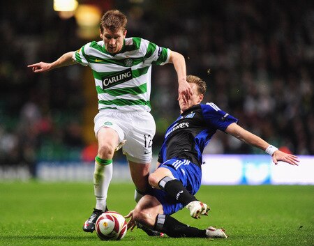 GLASGOW, SCOTLAND - OCTOBER 22:  Mark Wilson of Celtic is tackled by Marcell Jansen of Hamburg SV during the UEFA Europa League Group C match between Celtic and Hamburg SV at Celtic Park on October 22, 2009 in Glasgow, Scotland.  <br /><br /><span class="help">(Photo by Mike Hewitt/Bongarts/Getty Images)</span>
