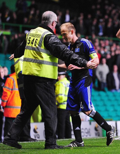 GLASGOW, SCOTLAND - OCTOBER 22:  Hamburgs captain David Jarolim is prevented from approaching his own supporters by a Celtic steward after the UEFA Europa League Group C match between Celtic and Hamburg SV at Celtic Park on October 22, 2009 in Glasgow, Scotland.  <br /><br /><span class="help">(Photo by Mike Hewitt/Bongarts/Getty Images)</span>