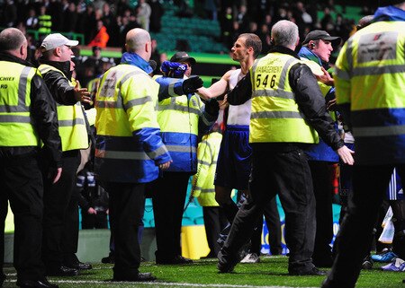 GLASGOW, SCOTLAND - OCTOBER 22:  David Rozehnal of Hamburg SV is prevented from throwing his match shirt into the travelling Hamburg fans by Celtic stewards at the end of the UEFA Europa League Group C match between Celtic and Hamburg SV at Celtic Park on October 22, 2009 in Glasgow, Scotland.  <br /><br /><span class="help">(Photo by Mike Hewitt/Bongarts/Getty Images)</span>