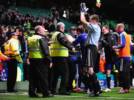 GLASGOW, SCOTLAND - OCTOBER 22:  Joris Mathijsen of Hamburg SV (blue shirt, no 5 on shorts) argues with Celtic stewards while goallkeeper Frank Rost is celebrating at the end of the UEFA Europa League Group C match between Celtic and Hamburg SV at Celtic Park on October 22, 2009 in Glasgow, Scotland.  <br /><br /><span class="help">(Photo by Mike Hewitt/Bongarts/Getty Images)</span>