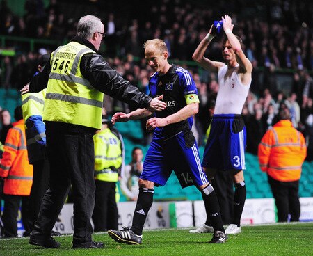 GLASGOW, SCOTLAND - OCTOBER 22:  Hamburg captain David Jarolim is prevented from approaching his own supporters by a Celtic steward after the UEFA Europa League Group C match between Celtic and Hamburg SV at Celtic Park on October 22, 2009 in Glasgow, Scotland.  <br /><br /><span class="help">(Photo by Mike Hewitt/Bongarts/Getty Images)</span>