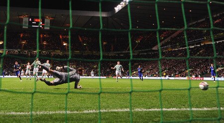 GLASGOW, SCOTLAND - OCTOBER 22:  Marcus Berg of Hamburg SV (left) scores past a diving goalkeeper Artur Boruc of Celtic during the UEFA Europa League Group C match between Celtic and Hamburg SV at Celtic Park on October 22, 2009 in Glasgow, Scotland.  <br /><br /><span class="help">(Photo by Mike Hewitt/Bongarts/Getty Images)</span>