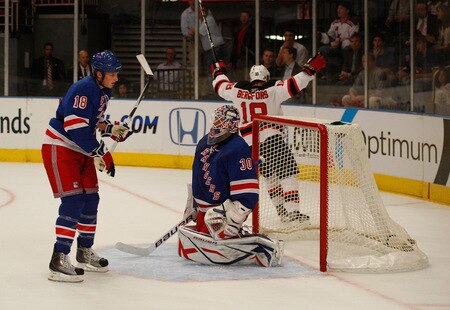 NEW YORK - OCTOBER 22: Nicklas Bergfors #18 of the New Jersey Devils celebrates in front of Marc Staal and Henrik Lundqvist #30 of the New York Rangers after scoring in the first period during the game on October 22, 2009 at Madison Square Garden in New York City. <br /><br /><span class="help">(Photo by Jared Wickerham/Getty Images)</span>
