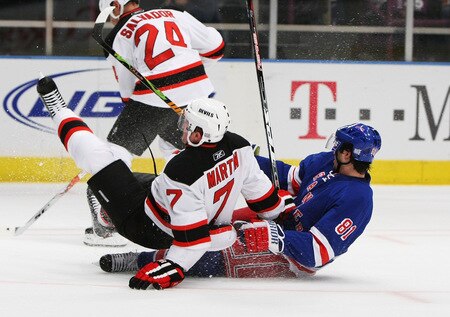 NEW YORK, NY - OCTOBER 22:  Enver Lisin #81 of the New York Rangers collides with Paul Martin #7 of the New Jersey Devils during their game on October 22, 2009 at Madison Square Garden in New York City, New York.  <br /><br /><span class="help">(Photo by Al Bello/Getty Images)</span>
