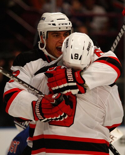 NEW YORK - OCTOBER 22:  Dainius Zubrus #8 of the New Jersey Devils celebrates with Zach Parise #9 after Zubrus scored a goal in third period against the New York Rangers on October 22, 2009 at Madison Square Garden in New York City.  <br /><br /><span class="help">(Photo by Jared Wickerham/Getty Images)</span>
