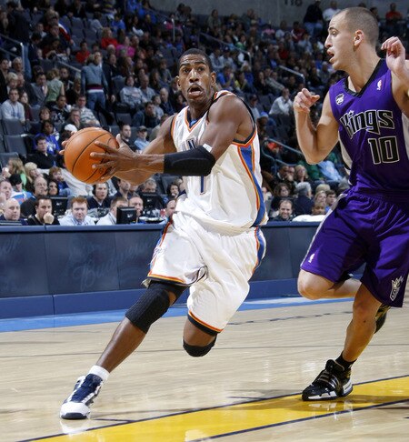 OKLAHOMA CITY - OCTOBER 22:  Kevin Ollie #7 of the Oklahoma City Thunder drives toward the basket while being guarded by Sergio Rodriguez #10 of the Sacremento Kings on October 22, 2009 at the Ford Center in Oklahoma City, Oklahoma. <br /><br /><span class="help">(Photo by Layne Murdoch/NBAE via Getty Images)</span>