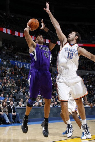OKLAHOMA CITY - OCTOBER 22:  Sean May #42 of the Sacremento Kings shoots over Nenad Krstic #12 of the Oklahoma City Thunder on October 22, 2009 at the Ford Center in Oklahoma City, Oklahoma. <br /><br /><span class="help">(Photo by Layne Murdoch/NBAE via Getty Images)</span>