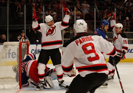 NEW YORK - OCTOBER 22:  Dainius Zubrus #8 of the New Jersey Devils celebrates with Zach Parise #9 after he scored a goal in third period against the New York Rangers on October 22, 2009 at Madison Square Garden in New York City.  <br /><br /><span class="help">(Photo by Jared Wickerham/Getty Images)</span>