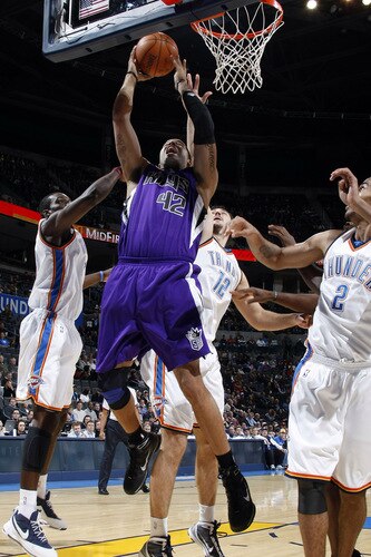 OKLAHOMA CITY - OCTOBER 22:  Sean May #42 of the Sacremento Kings goes to the basket against Jeff Green #22, Nenad Krstic #12, and Thabo Sefolosha #2 the Oklahoma City Thunder on October 22, 2009 at the Ford Center in Oklahoma City, Oklahoma. <br /><br /><span class="help">(Photo by Layne Murdoch/NBAE via Getty Images)</span>