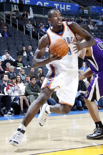 OKLAHOMA CITY - OCTOBER 22:  Sergio Ibaka #9 of the Oklahoma City Thunder dribbles past Sean May #42 of the Sacremento Kings on October 22, 2009 at the Ford Center in Oklahoma City, Oklahoma. <br /><br /><span class="help">(Photo by Layne Murdoch/NBAE via Getty Images)</span>