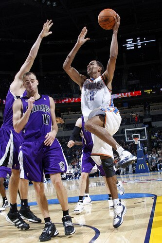 OKLAHOMA CITY - OCTOBER 22:  Thabo Sefolosha #2 of the Oklahoma City Thunder shoots over Sergio Rodriguez #10 of the Sacremento Kings on October 22, 2009 at the Ford Center in Oklahoma City, Oklahoma. <br /><br /><span class="help">(Photo by Layne Murdoch/NBAE via Getty Images)</span>