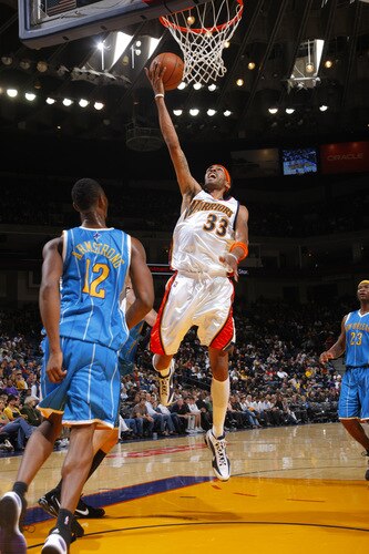 OAKLAND, CA - OCTOBER 22: Mikki Moore #33 of the Golden State Warriors goes in for a lay-up against the New Orleans Hornets on October 22, 2009 at Oracle Arena in Oakland, California. <br /><br /><span class="help">(Photo by Rocky Widner/NBAE via Getty Images)</span>
