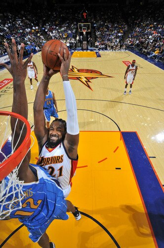 OAKLAND, CA - OCTOBER 22: Ronny Turiaf #21 of the Golden State Warriors goes for the monster dunk against the New Orleans Hornets on October 22, 2009 at Oracle Arena in Oakland, California. <br /><br /><span class="help">(Photo by Rocky Widner/NBAE via Getty Images)</span>