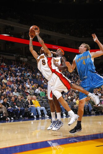 OAKLAND, CA - OCTOBER 22: Monta Ellis #8 of the Golden State Warriors soars for the board against the New Orleans Hornets on October 22, 2009 at Oracle Arena in Oakland, California. <br /><br /><span class="help">(Photo by Rocky Widner/NBAE via Getty Images)</span>