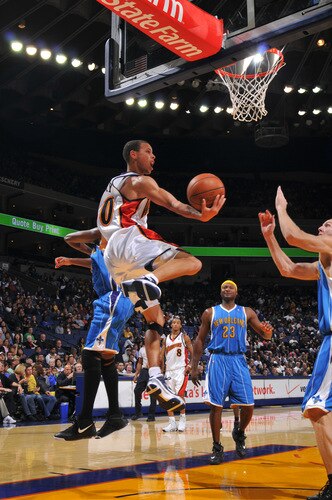 OAKLAND, CA - OCTOBER 22: Stephen Curry #30 of the Golden State Warriors scores on the up and under against the New Orleans Hornets on October 22, 2009 at Oracle Arena in Oakland, California. <br /><br /><span class="help">(Photo by Rocky Widner/NBAE via Getty Images)</span>