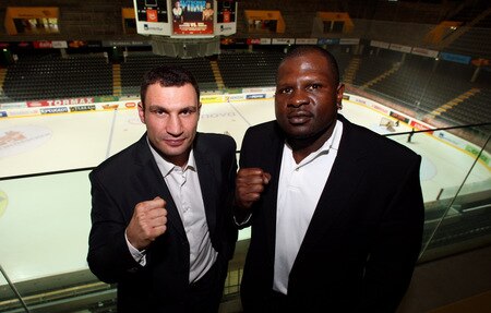 BERN, SWITZERLAND - OCTOBER 23:  Vitali Klitschko (L) and Kevin Johnson pose for the media in front of the Post Finance Arena after a news conference October 23, 2009 in Bern, Switzerland. The WBC Heavyweight Championship fight between Vitali Klitschko of Ukraine and Kevin Johnson of the United States will take place at the Finance Arena on December 12, 2009 in Bern, Switzerland.  <br /><br /><span class="help">(Photo by Miguel Villagran/Bongarts/Getty Images)</span>