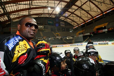 BERN, SWITZERLAND - OCTOBER 23: Kevin Johnson (L) greets children playing ice hockey on the ice of the Post Finance Arena after a news conference October 23, 2009 in Bern, Switzerland. The WBC Heavyweight Championship fight between Vitali Klitschko of Ukraine and Kevin Johnson of the United States will take place at the Finance Arena on December 12, 2009 in Bern, Switzerland.  <br /><br /><span class="help">(Photo by Miguel Villagran/Bongarts/Getty Images)</span>