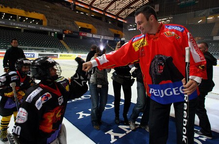 BERN, SWITZERLAND - OCTOBER 23:  Vitali Klitschko (R) greets children playing ice hockey on the ice of the Post Finance Arena after a news conference October 23, 2009 in Bern, Switzerland. The WBC Heavyweight Championship fight between Vitali Klitschko of Ukraine and Kevin Johnson of the United States will take place at the Finance Arena on December 12, 2009 in Bern, Switzerland.  <br /><br /><span class="help">(Photo by Miguel Villagran/Bongarts/Getty Images)</span>