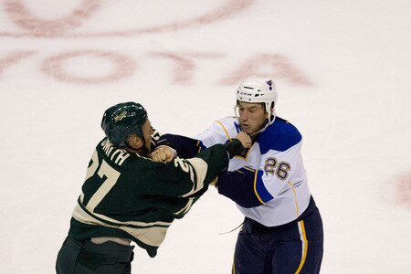 ST. LOUIS, MO. - OCTOBER 23: Nathan Smith #27 of the Minnesota Wild fights BJ Crombeen #26 of the St. Louis Blues at the Scottrade Center on October 23, 2009 in St. Louis, Missouri.  <br /><br /><span class="help">(Photo by Dilip Vishwanat/Getty Images)</span>