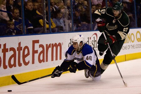 ST. LOUIS, MO. - OCTOBER 23: Roaman Polak #46 of the St. Louis Blues is tripped by Benoit Pouliot #67 of the Minnesota Wild at the Scottrade Center on October 23, 2009 in St. Louis, Missouri.  <br /><br /><span class="help">(Photo by Dilip Vishwanat/Getty Images)</span>