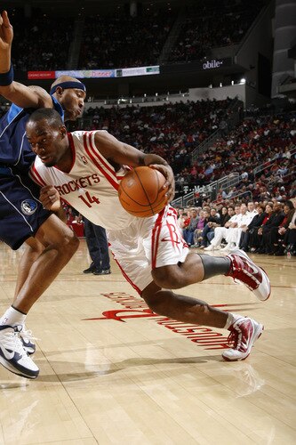 HOUSTON - OCTOBER 23:  Carl Landry #14 of the Houston Rockets drives the ball past Jason Terry #31 of the Dallas Mavericks on October 23, 2009 at the Toyota Center in Houston, Texas. <br /><br /><span class="help">(Photo by Bill Baptist/NBAE via Getty Images)</span>