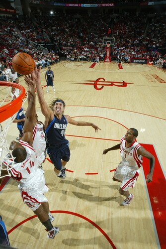 HOUSTON - OCTOBER 23:  Dirk Nowitzki #41 of the Dallas Mavericks shoots the ball over Carl Landry #14 of the Houston Rockets on October 23, 2009 at the Toyota Center in Houston, Texas. <br /><br /><span class="help">(Photo by Bill Baptist/NBAE via Getty Images)</span>