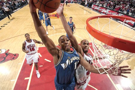 CHICAGO - OCTOBER 23:  Randy Foye #15 of the Washington Wizards brings the ball towards the hoop as Taj Gibson #22 of the Chicago Bulls reaches towards the ball during the NBA preseason game on October 23, 2009 at the United Center in Chicago, Illinois. <br /><br /><span class="help">(Photo by Randy Belice/NBAE via Getty Images)</span>