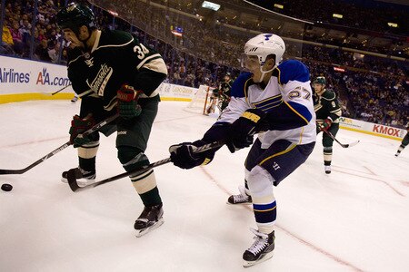 ST. LOUIS, MO. - OCTOBER 23: David Perron #57 of the St. Louis Blues looks to steal the puck from Shane Hnidy #34 of the Minnesota Wild at the Scottrade Center on October 23, 2009 in St. Louis, Missouri.  The Blues beat the Wild 3-1.  <br /><br /><span class="help">(Photo by Dilip Vishwanat/Getty Images)</span>