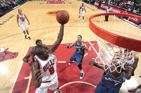 CHICAGO - OCTOBER 23:  Luol Deng #9 of the Chicago Bulls brings the ball up to the basket as Brendan Haywood #33 and Mike Miller #6 of the Washington Wizards watches from underneath during the NBA preseason game on October 23, 2009 at the United Center in Chicago, Illinois. <br /><br /><span class="help">(Photo by Randy Belice/NBAE via Getty Images)</span>