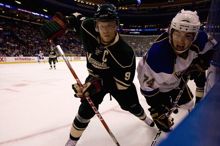 ST. LOUIS, MO. - OCTOBER 23: TJ Oshi #74 of the St. Louis Blues races to the puck against Mikko Koivu #9 of the Minnesota Wild at the Scottrade Center on October 23, 2009 in St. Louis, Missouri.  The Blues beat the Wild 3-1.  <br /><br /><span class="help">(Photo by Dilip Vishwanat/Getty Images)</span>